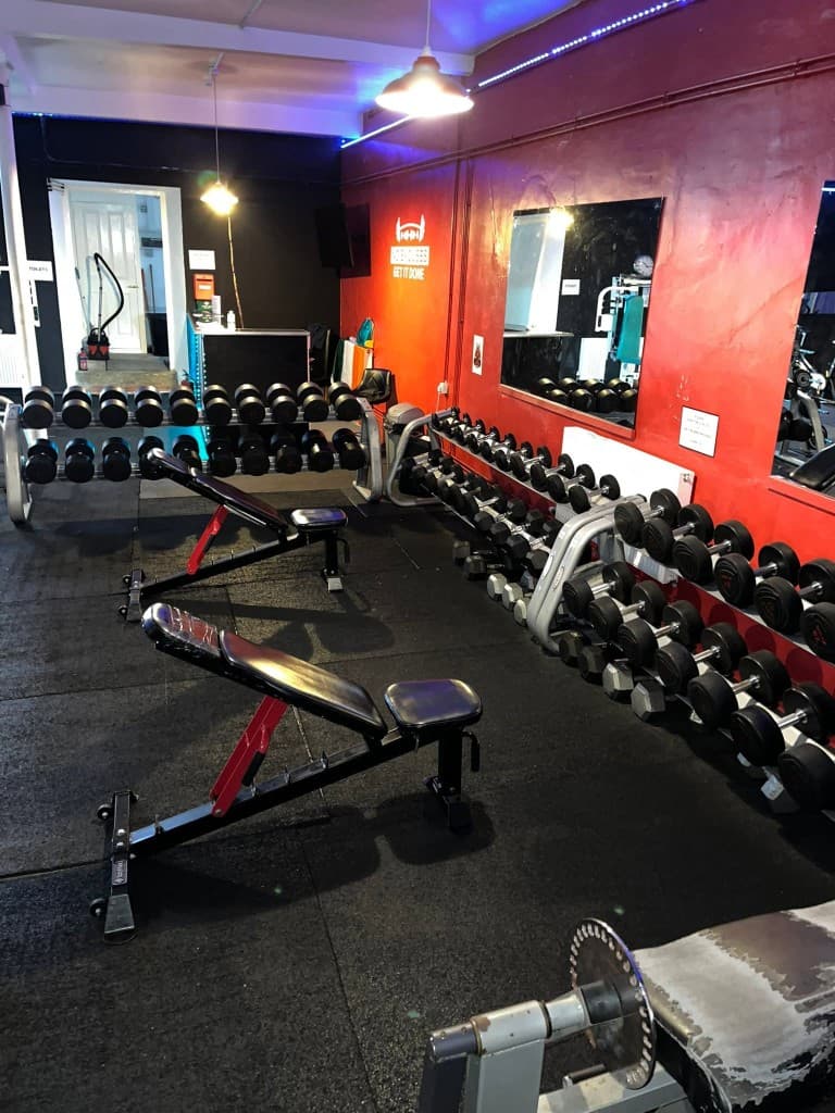 Dumbbell racks and weight benches at Big Dragons Gym